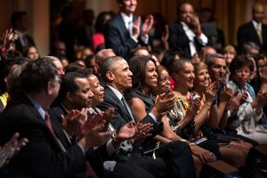 President Barack Obama and First Lady Michelle Obama listen to Michelle Williams perform during "The Gospel Tradition: In Performance at the White House" in the East Room of the White House, April 14, 2015. (Official White House Photo by Pete Souza) This photograph is provided by THE WHITE HOUSE as a courtesy and is for promotional use only on the PBS website as related to the airing of ÒThe Gospel Tradition: In Performance at the White House" concert. The photograph may not be manipulated in any way and may not otherwise be reproduced, disseminated or broadcast, without the written permission of the White House Photo Office. The photograph may not be used in any commercial or political materials, advertisements, emails, products, promotions that in any way suggests approval or endorsement of the President, the First Family, or the White House.